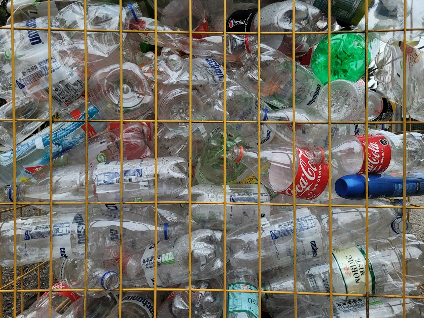 Bundled plastic bottles collected and caged for recycling